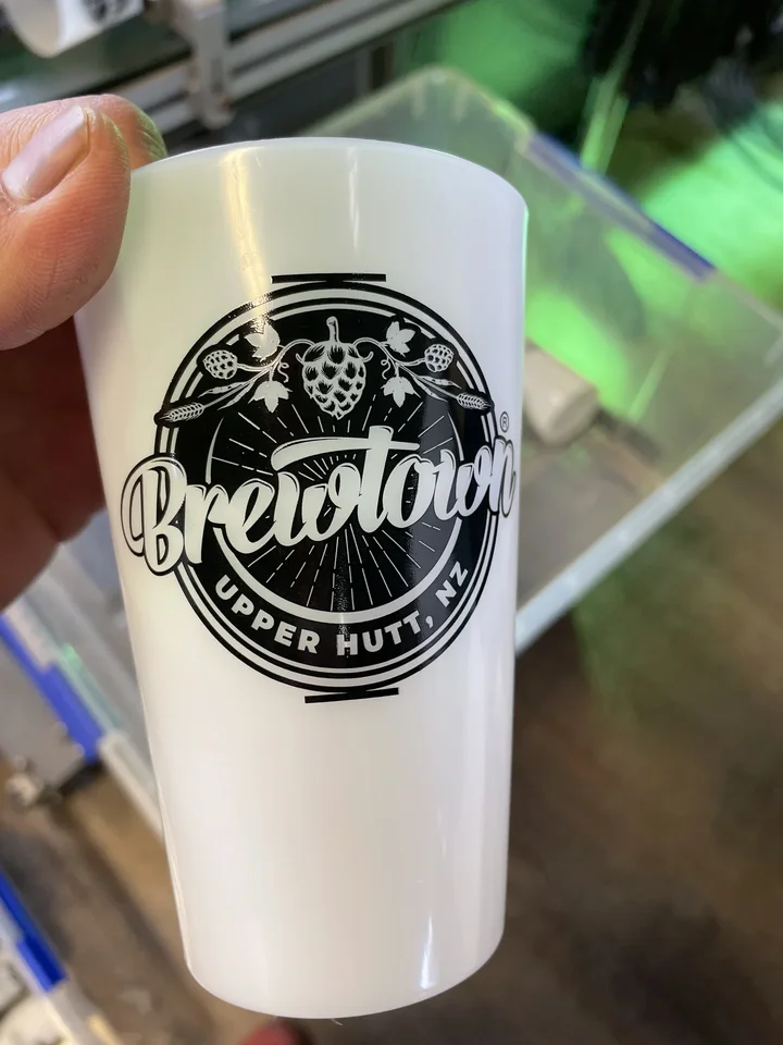 Frosted cup printed with the Brewtown Upper Hutt logo