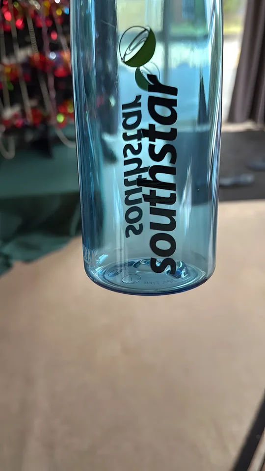 Blue drink bottle wrap-printed with the Southstar logo